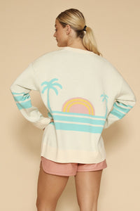 Miss Sparkling Ocean Sunset knit cardigan featuring a colorful, patterned design with long sleeves and a cozy fit.