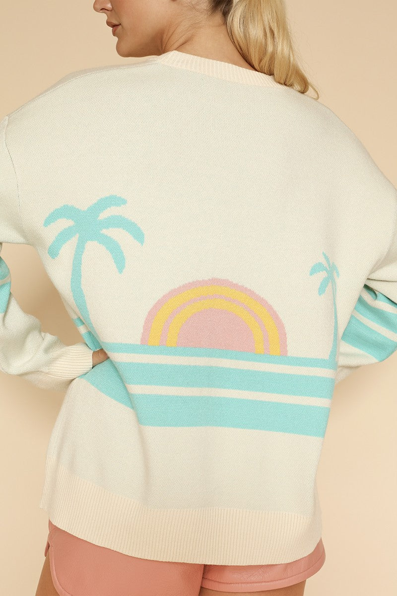 Miss Sparkling ocean sunset knit cardigan with a relaxed fit, featuring soft fabric in warm sunset colors.