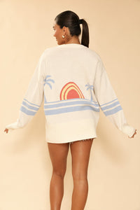 Miss Sparkling Ocean Sunset knit cardigan with a colorful, cozy design, featuring a relaxed fit and ribbed cuffs.