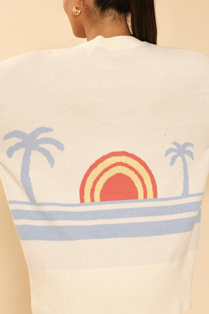 Miss Sparkling ocean sunset knit cardigan displayed on a hanger, featuring a soft, colorful ocean sunset pattern and cozy knit texture.