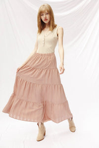 Miss Sparkling Prairie Maxi Skirt with floral print, flowing fabric, and high waist, styled with a casual top and accessories.