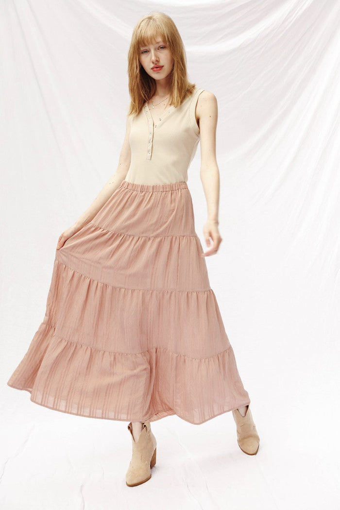 Miss Sparkling Prairie Maxi Skirt with floral print, flowing fabric, and high waist, styled with a casual top and accessories.
