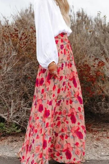 Pink Miss Sparkling floral maxi skirt with a flowing silhouette and vibrant floral pattern, perfect for summer or casual wear.