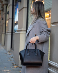 Black Mizuri Leather Lorenza Women's Bag in medium size with sleek leather design, perfect for everyday use.