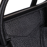 Black Lorenza leather women's bag by Mizuri Leather, medium-sized with stylish design and adjustable strap.