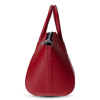 Black Mizuri Leather Lorenza women's medium leather bag with sleek design and adjustable strap, perfect for everyday use.