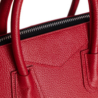 Black Mizuri Leather Lorenza Women's Bag in medium size, stylish leather handbag with elegant design and sturdy handles.