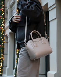 Black Mizuri Leather Lorenza medium women's bag with sleek leather design and top handles for versatile style.