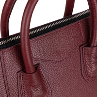 Black Mizuri Leather Lorenza women's medium leather bag with sturdy handles and sleek design.