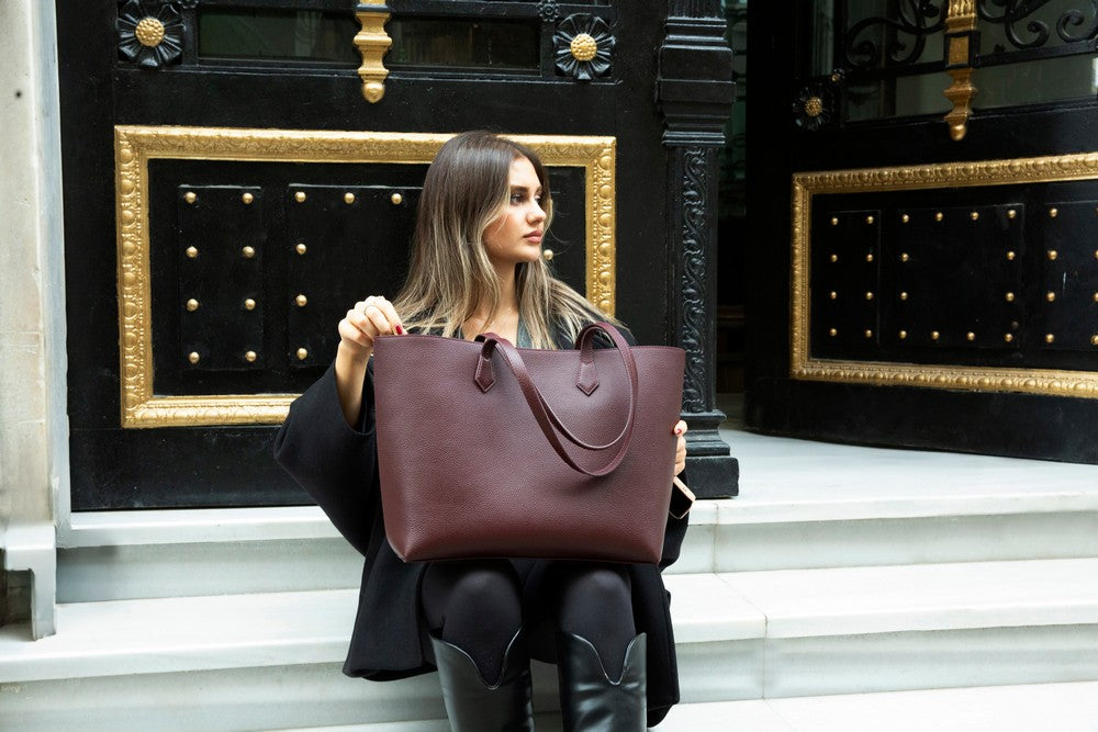 Black Mizuri Leather Solea women's bag with sleek design and top handle, made of genuine leather for versatile style.