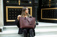 Black Mizuri Leather Solea women's bag with sleek design and top handle, made of genuine leather for versatile style.