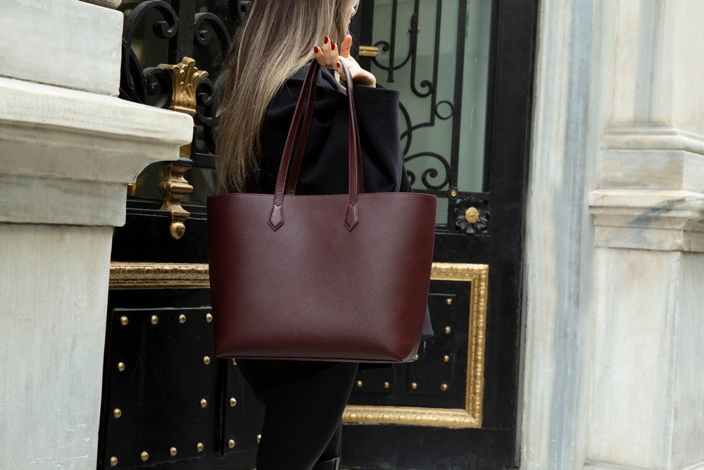 Black Mizuri Leather Solea Women's Bag with sleek design, featuring top handles and spacious interior for everyday use.