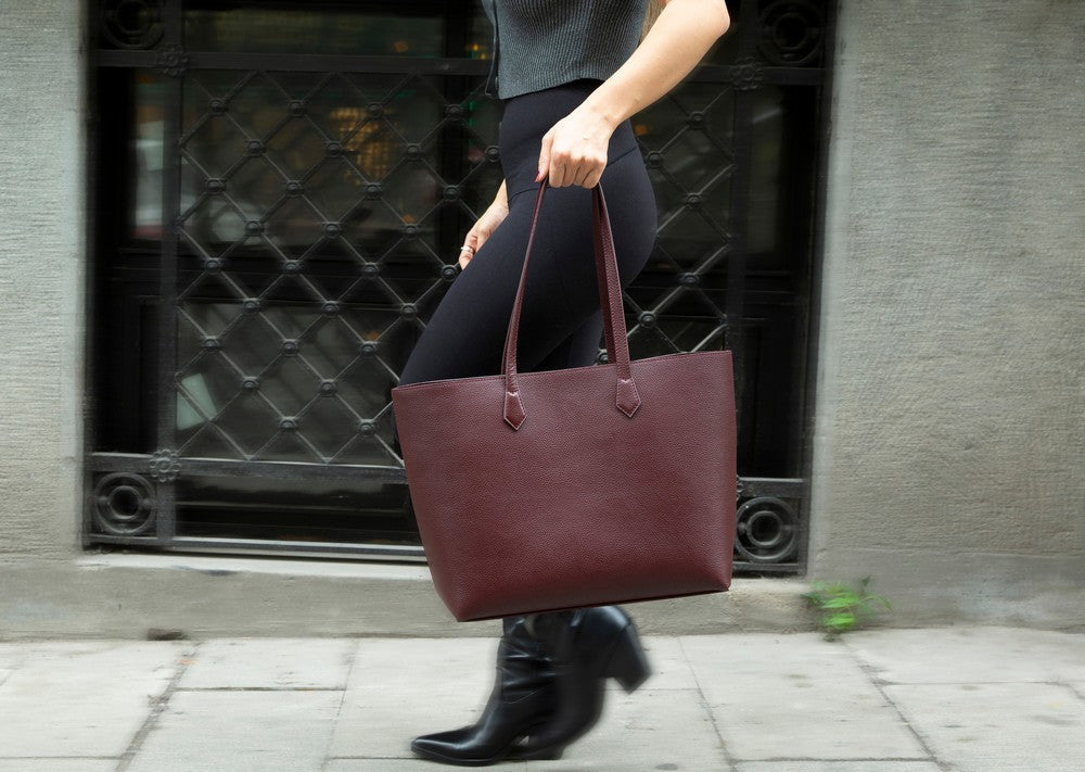 Black Mizuri Leather Solea women’s bag with sleek design, featuring durable leather and stylish handles.