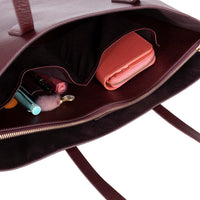 Black Mizuri Leather Solea Women's Bag with sleek design, featuring top handles and spacious interior for everyday use.
