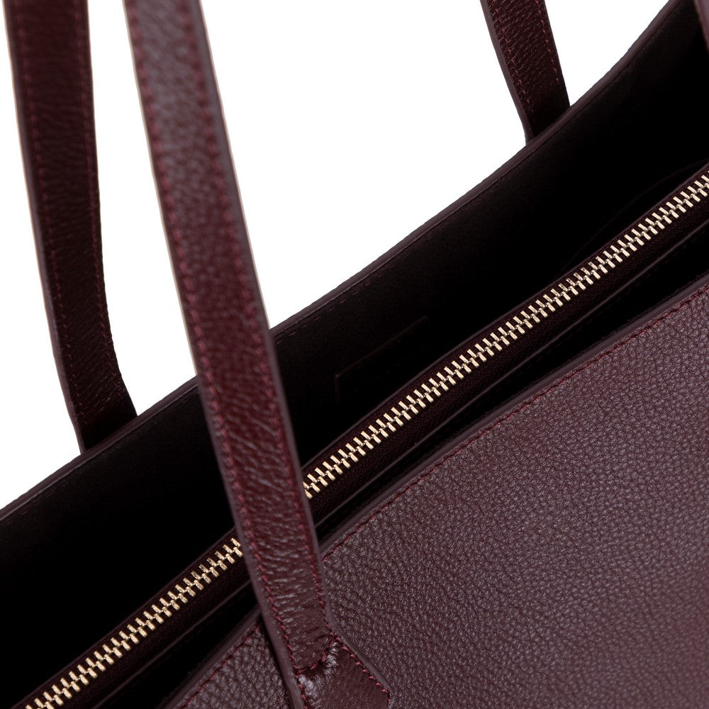 Black Mizuri Leather Solea Women's Bag showing sleek leather exterior with top handles and a minimalist design.