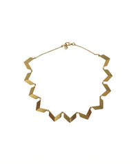 Gold triangle necklace from Modafleur, close-up of the jewelry piece with a sleek, modern design.