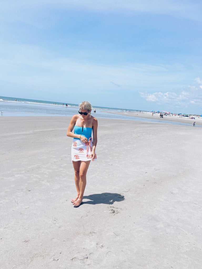 Orange Modafleur The Lotus Sarong displayed with flowing fabric and intricate patterns, perfect for beach or casual wear.