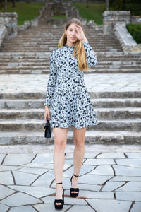 Modafleur The Ellis Dress in XS, stylish clothing with a flattering fit, displayed on a hanger against a neutral background.