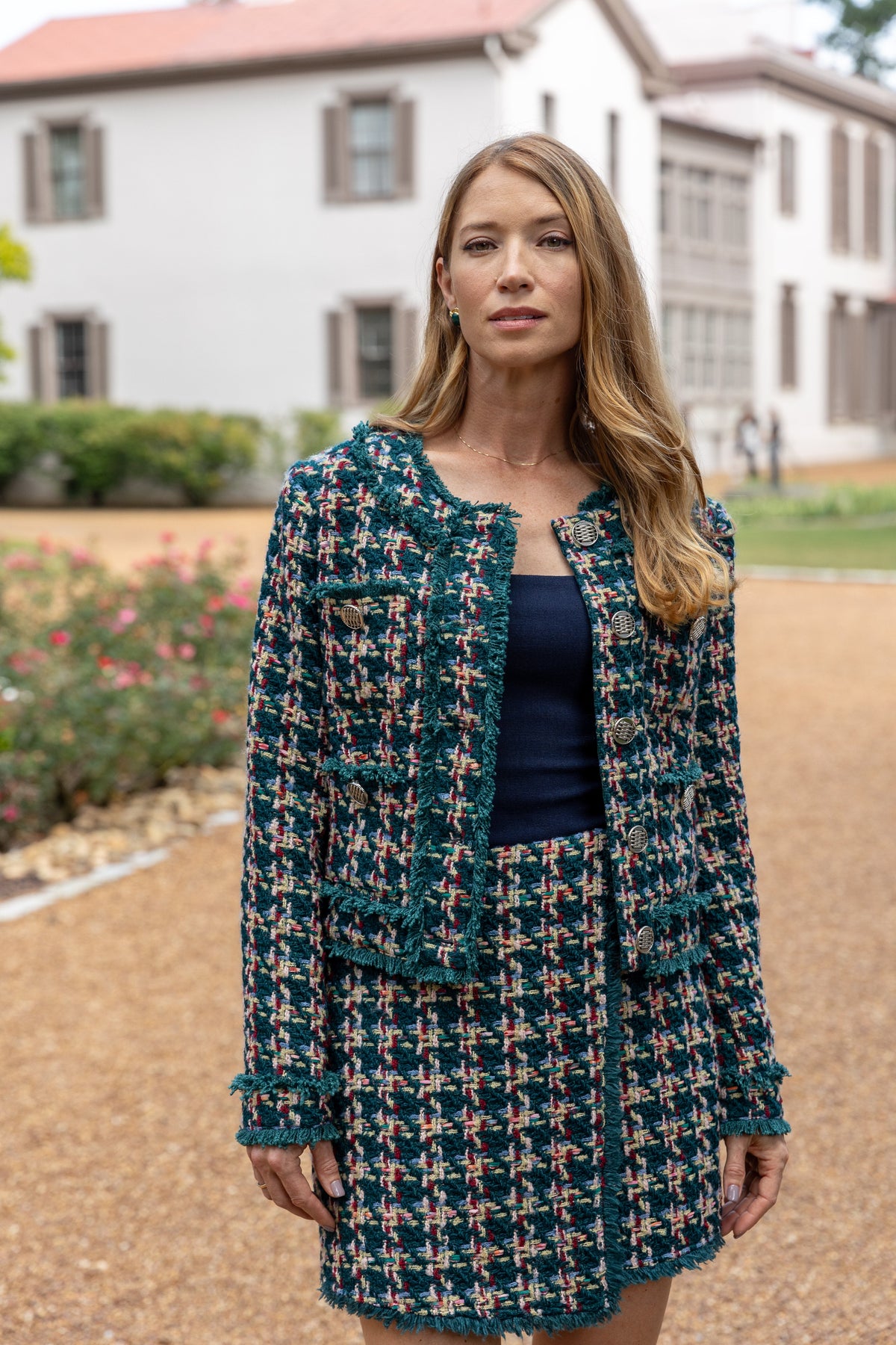 Modafleur The Jackie Tweed Skirt in light tweed fabric, showing a close-up of the stylish high-waisted skirt with textured pattern.