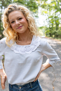 Modafleur The Louise Top in XS, stylish women's clothing with a fitted design and soft fabric, shown on a model.
