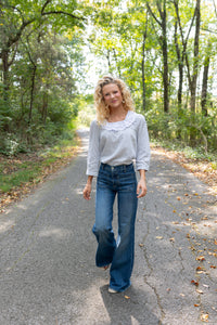 Modafleur The Louise Top, light-colored clothing top with a relaxed fit, shown on a model.