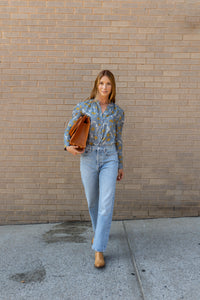Modafleur The Marie Top in Blue Bell, a stylish women's clothing piece featuring a fitted design and vibrant color.