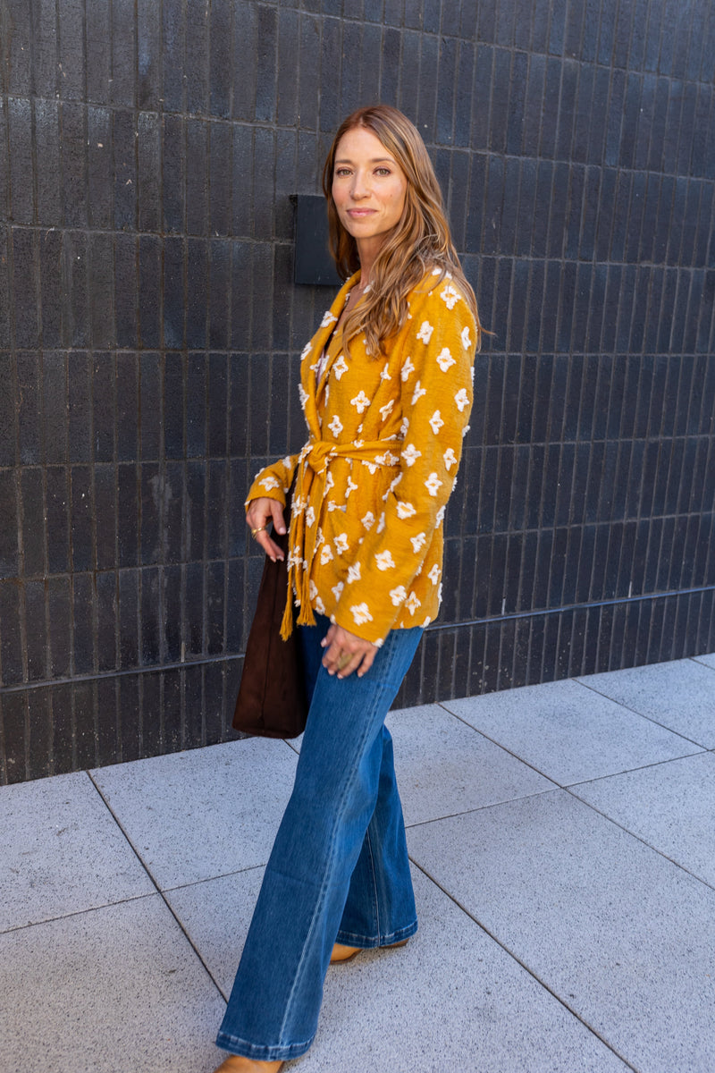 Modafleur The Stevie Shirt Jacket, lightweight clothing with a classic button-up design, shown in a close-up view.