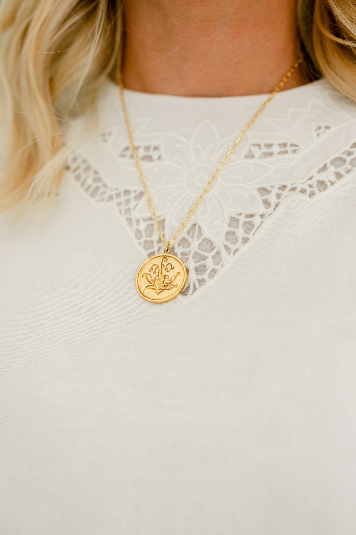 Modafleur The Snow Drop Necklace featuring a delicate snowflake pendant on a silver chain.