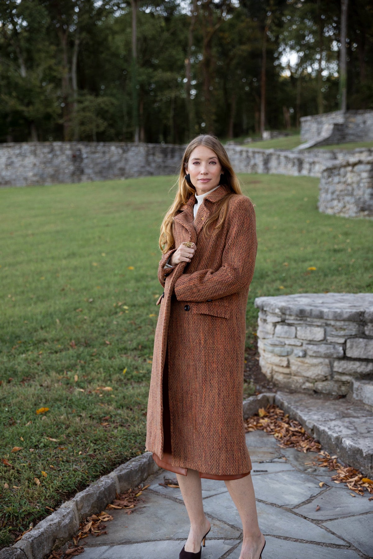 Light gray Modafleur Ivy Coat displayed on a hanger, featuring a classic tailored design with a collar and long sleeves.
