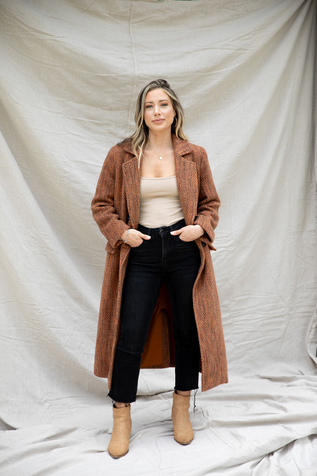 Modafleur Ivy Coat in XS, stylish navy wool coat with a tailored fit and classic collar, displayed on a hanger.