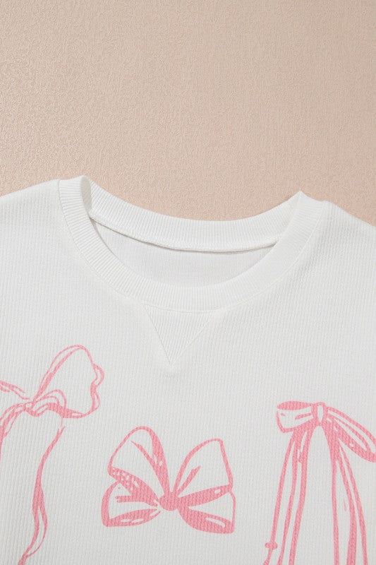 Long sleeve crewneck top with bow detail from My Pampered Life Seattle, featuring a comfortable fit and stylish design.
