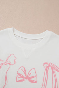 Long sleeve crewneck top with bow detail from My Pampered Life Seattle, featuring a comfortable fit and stylish design.