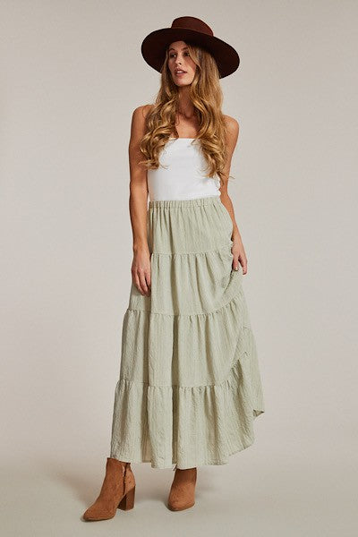 Light blue Miss Sparkling Prairie Maxi Skirt from My Pampered Life Seattle, shown on a dress form, flowing and elegant.