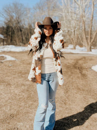 Miss Sparkling cow print Sherpa jacket from My Pampered Life Seattle, featuring cozy, plush fabric and stylish cow pattern.