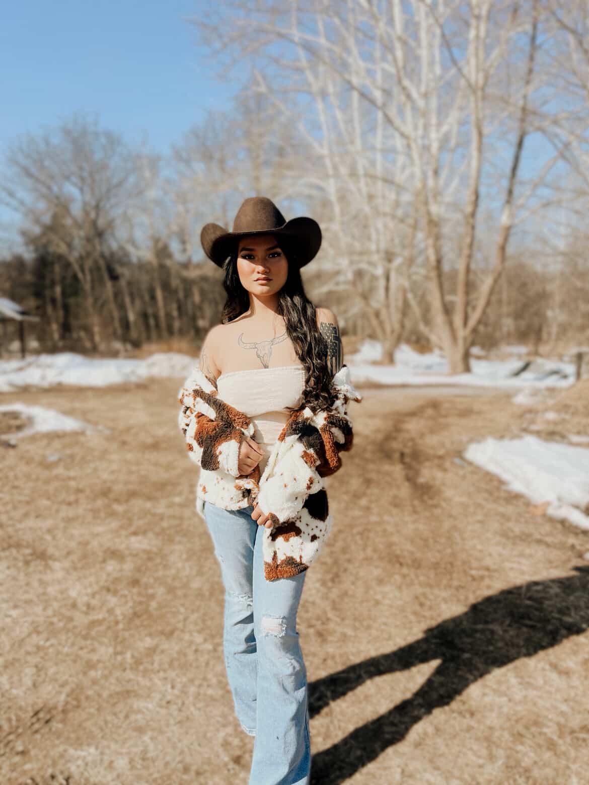 Miss Sparkling cow print sherpa jacket from My Pampered Life Seattle, featuring a cozy, stylish cow print design and plush fabric.