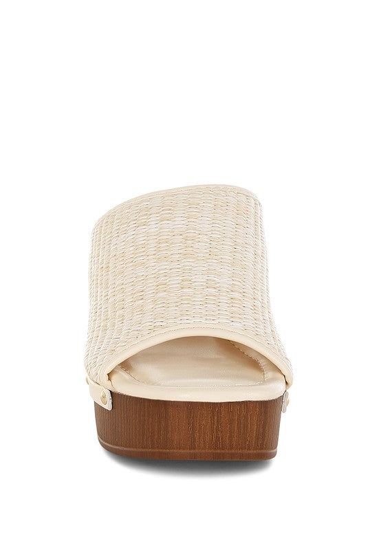 Marengo Raffia Wooden Clogs from My Pampered Life Seattle, featuring woven raffia uppers and wooden soles, casual footwear style.