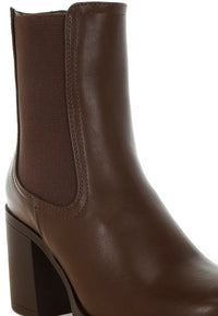 Black faux leather Chelsea boots from My Pampered Life Seattle featuring elastic side panels and a sleek, modern design.
