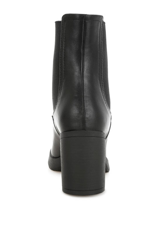 Black faux leather Chelsea boots from My Pampered Life Seattle, stylish ankle footwear with elastic side panels.