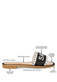 Luxe Getaway Beaded Saint Tropez Flat Slip Ons by My Pampered Life Seattle, featuring beaded details and a sleek slip-on design.