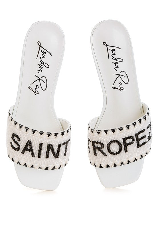 My Pampered Life Seattle Poshta Saint Tropez beaded slip-on heels featuring a sleek design and intricate beadwork.