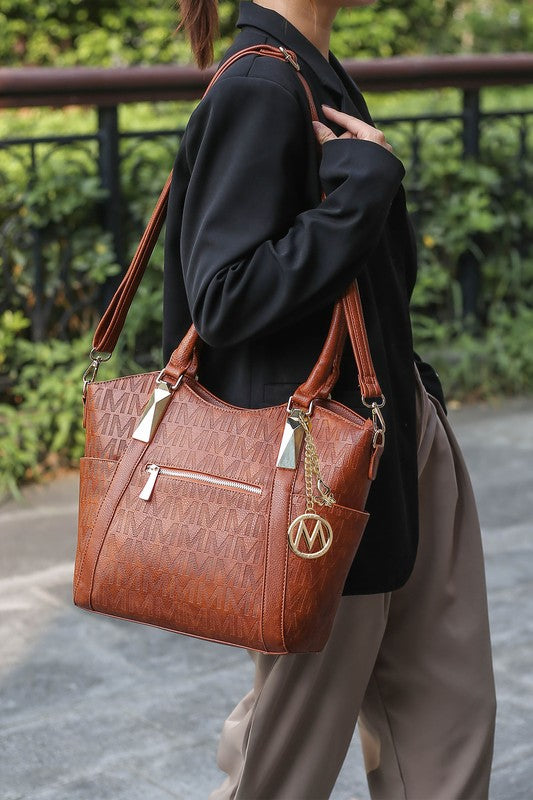 Black MKF Collection Hazel vegan leather tote bag by Mia K, featuring a spacious design and sturdy handles, for versatile everyday use.