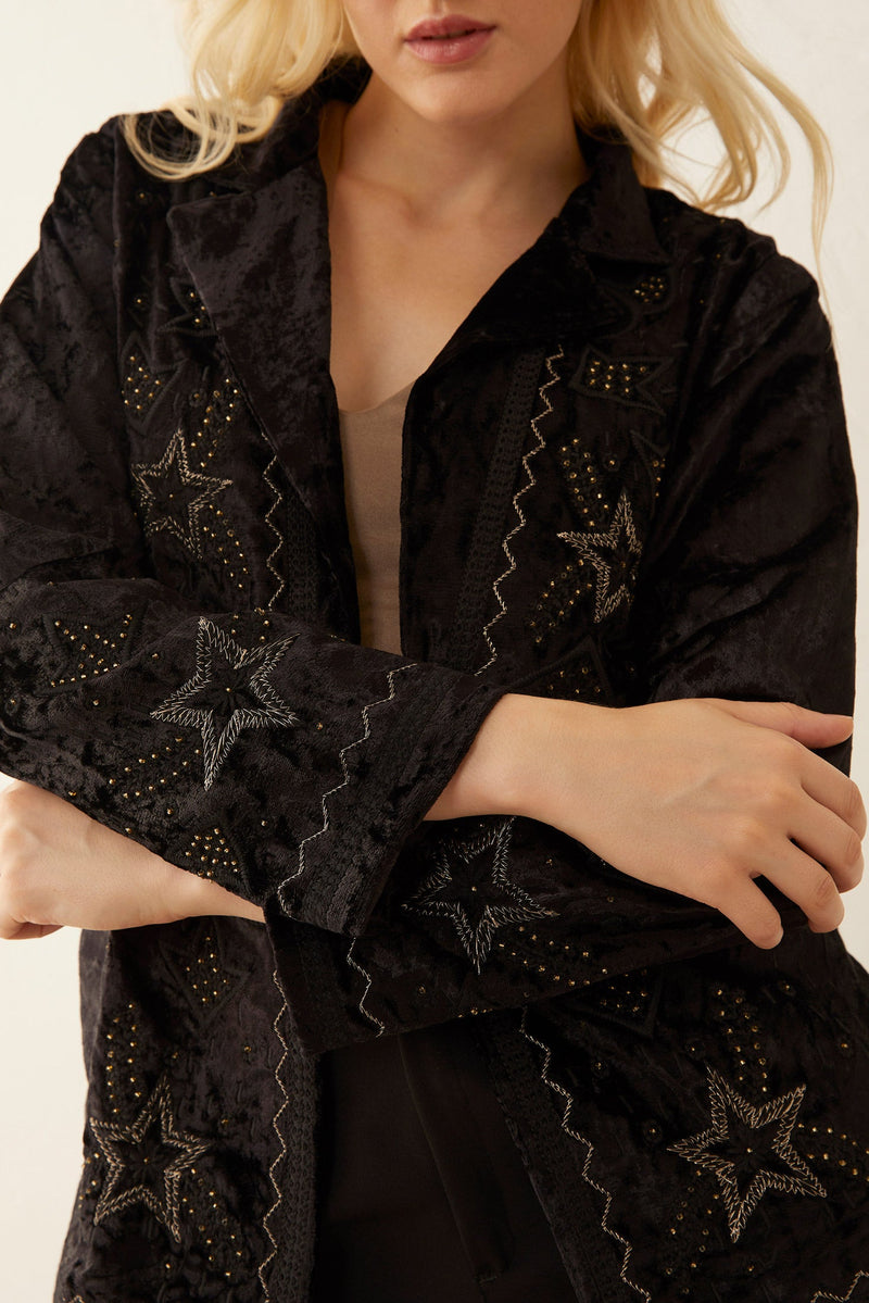 Black Night Star jacket by Myra USA, small size, stylish apparel with a star pattern, shown on a hanger.