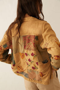 Myra USA Beth Marie patchwork jacket with colorful fabric panels, casual style, and button closure, displayed on a hanger.