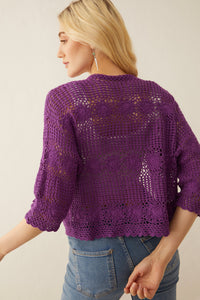Myra USA Eloise knitted sweater jacket, cozy knitwear with a stylish design, shown on a hanger with a neutral background.
