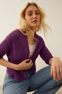 Myra USA Eloise knitted sweater jacket, cozy knitwear with a stylish fit, shown in a close-up view of the garment's fabric and design.