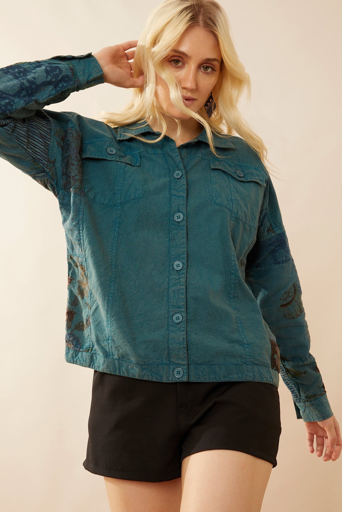 Myra USA Klinhorne Ridge patchwork jacket featuring colorful fabric patches and stylish design, displayed on a hanger.