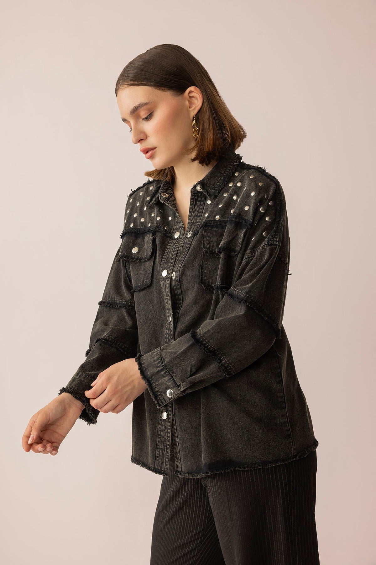 Black washed Pearl Dust Jacket by Myra USA, showcasing a stylish jacket with a textured finish and subtle pearl details.