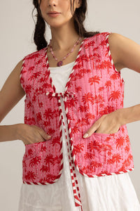 Myra USA Bohera Sunset Palms cotton jacket in blush pink, shown on a hanger with palm print details.