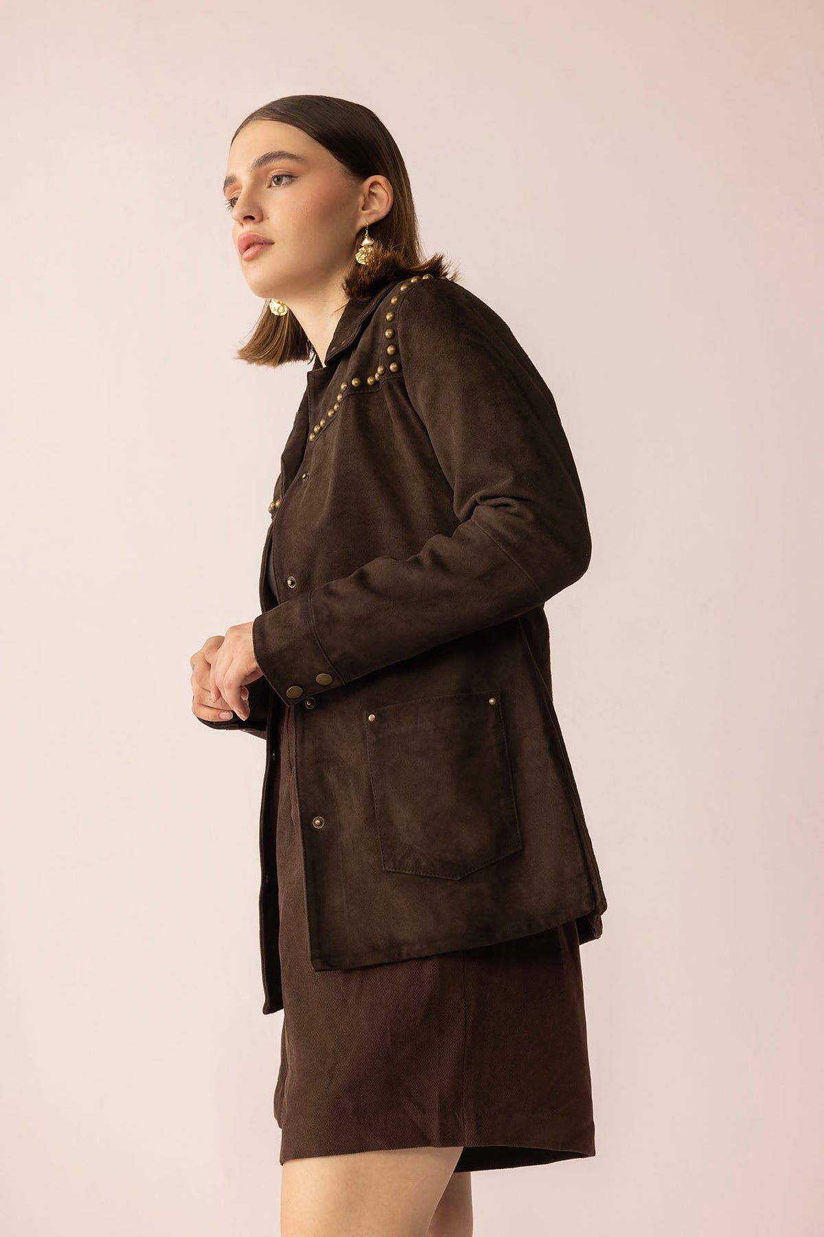 Myra USA Grit & Glisten Leather Jacket in Shadow Brown, close-up of stylish leather jacket with textured finish and modern design.