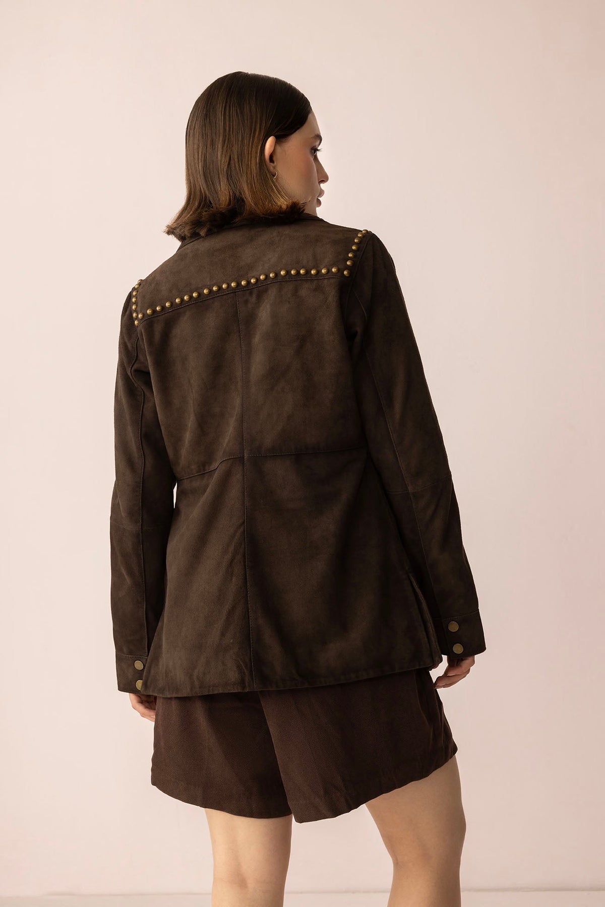 Myra USA Grit & Glisten Leather Jacket in Shadow Brown, close-up of stylish brown leather jacket with textured details.